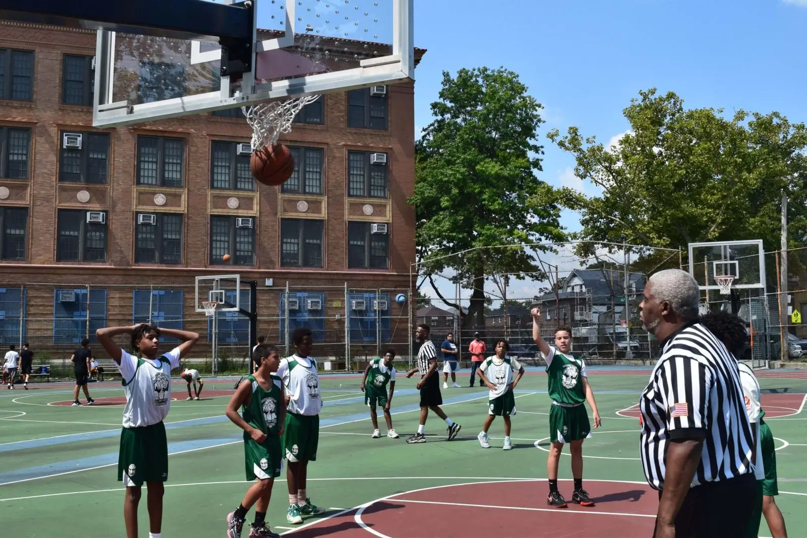 Basketball swishing through outdoor hoop